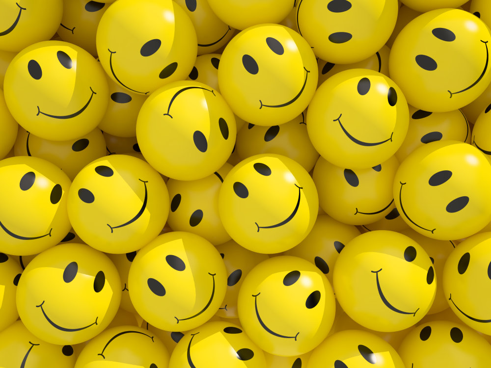 obrazek przedstawia uśmiechnięte twarze namalowane na małych piłeczkach, co symbolizuje wysoką ocene